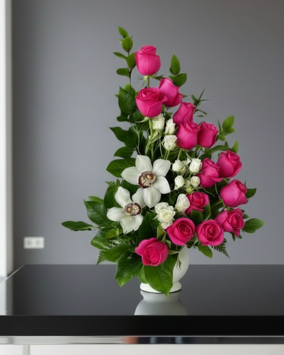Spiral design blend of 15 roses, spray roses, and orchids paired with lush greenery.
Gladys Flowers Miami - Valentine's