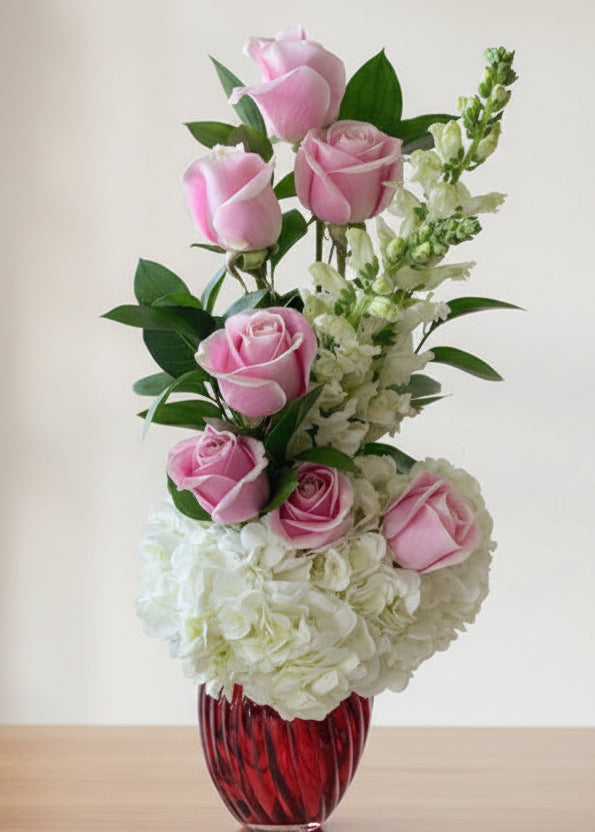 This small arrangement includes a beautiful mix of 8 roses, hydrangeas, and stock flowers. Perfect for any occasion. Romantic.